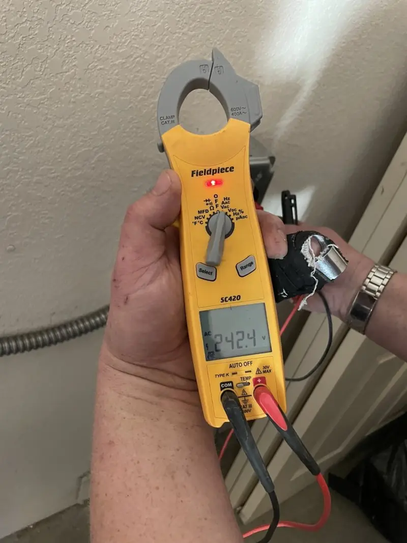Voltage testing with clamp meter during Ceiling Fan Installation in National Harbor